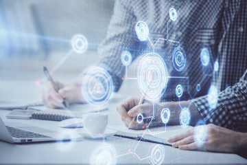 Businessman with computer background with technology theme hologram. Concept of hightech. Multi exposure.