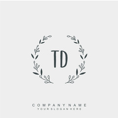 letter TD surrounded by beautiful and elegant flowers and leaves. Wedding monogram logo template.