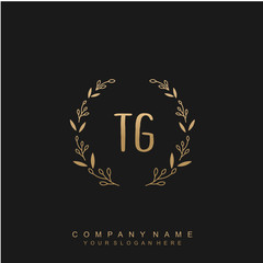 letter TG surrounded by beautiful and elegant flowers and leaves. Wedding monogram logo template.