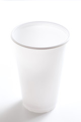 Empty white plastic cup isolated on white background shoot in studio.