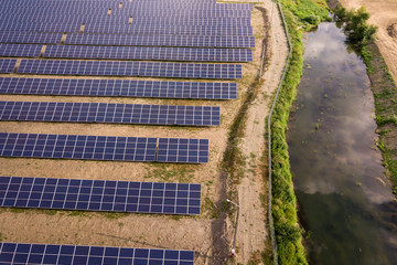 Aerial view of solar power plant. Electric panels for producing clean ecologic energy.