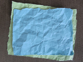 Crumpled paper blank. Torn colored paper  