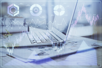 Forex market graph hologram and personal computer on background. Multi exposure. Concept of investment.