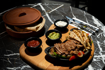 Mexican food. Beef and Chicken Fajitas - Traditional dish of Mexico