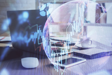 Double exposure of forex chart and work space with computer. Concept of international online...