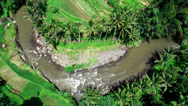View of beautiful rice terraces and Ayung River, popular as rafting river, Ubud, Bali.