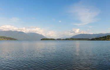 Serene panorama of the calm waters of Panguipulli Lake, from the village of Panguipulli. Patagonian area, Chile.