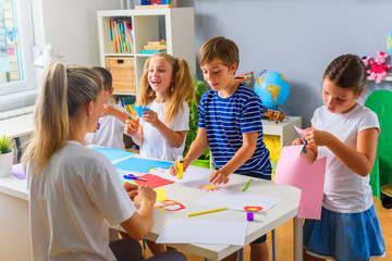 Preschool Teacher with Children at Kindergarten - Creative Art Class