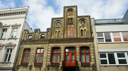 Fototapeta premium View of old brick house, beautiful architecture, sunny day, Lubeck, Germany