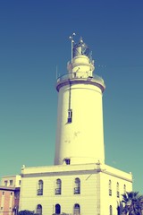 Malaga lighthouse. Spanish landmark. Retro filtered colors tone.