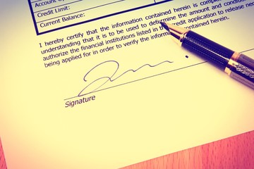 Signed contract. Vintage filtered color style.