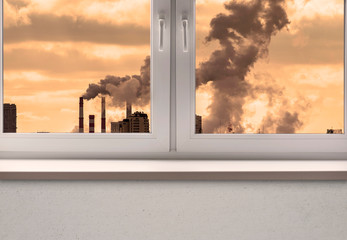 Air pollution over the City and clean white window frame with sill	