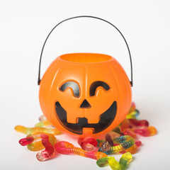 Jelly worms near trick or treat basket