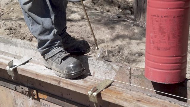 Spray concrete forms with oil Slow motion 2