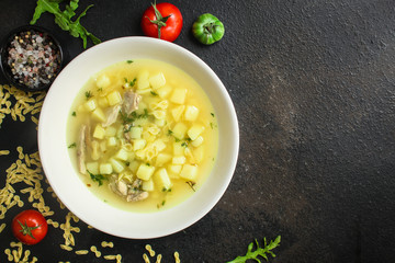 chicken soup farfalle - first course with pasta and vegetables, menu concept. food background. copy space