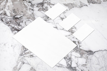 empty white vertical poster and horizontal rectangle business card mockups in isometric composition