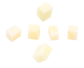 Potatoes cut into cubes (dices). Isolated on white background