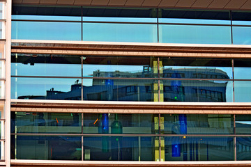 glass facade urban building with reflections fragment, urban environment,  office