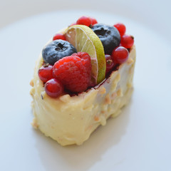 cake with berries raspberries, blueberries, strawberries, macro, blurred background