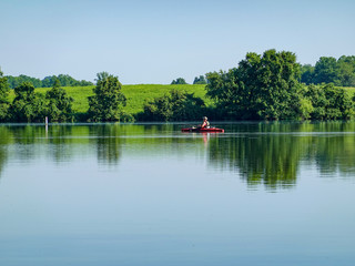 Person Kayaking in Lake
