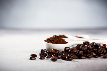 Coffee beans on gray background, copy space.