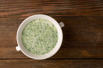 Cream soup broccoli top view on boards