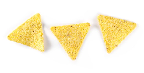 Corn tortilla chips pile, party snacks isolated on white background, top view