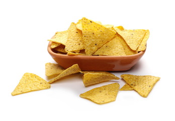 Corn tortilla chips pile in clay pot, bowl isolated on white background