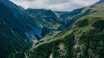 Fototapeta premium View of Kazbegi, Georgia. Beautiful natural mountain background. Summer