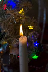 Happy new year 2020.Christmas decorations with Christmas fir candles on the background of lights and tinsel and Christmas balls.