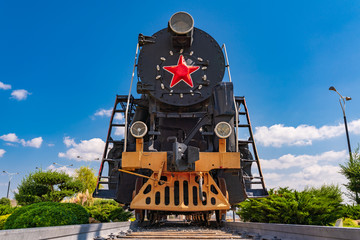 Old Soviet steam locomotive on a pedestal