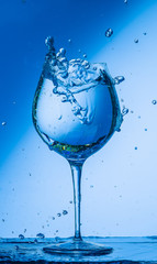 glass, wine, drink, water, alcohol, wineglass, blue, isolated, empty, white, liquid, transparent, clear, beverage, clean, object, crystal, goblet, reflection, drop, bar, single, fresh, cold, celebrati