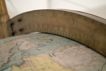 Fototapeta na wymiar Old Style World Globe close up. Antique big world globe with scale.