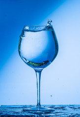 glass, wine, drink, water, alcohol, wineglass, blue, isolated, empty, white, liquid, transparent, clear, beverage, clean, object, crystal, goblet, reflection, drop, bar, single, fresh, cold, celebrati