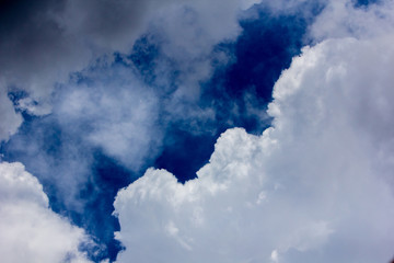 cumulus clouds against a blue sky