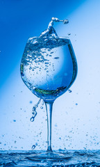 glass, wine, drink, water, alcohol, wineglass, blue, isolated, empty, white, liquid, transparent, clear, beverage, clean, object, crystal, goblet, reflection, drop, bar, single, fresh, cold, celebrati