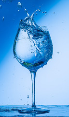 glass, wine, drink, water, alcohol, wineglass, blue, isolated, empty, white, liquid, transparent, clear, beverage, clean, object, crystal, goblet, reflection, drop, bar, single, fresh, cold, celebrati