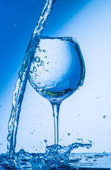 glass, wine, drink, water, alcohol, wineglass, blue, isolated, empty, white, liquid, transparent, clear, beverage, clean, object, crystal, goblet, reflection, drop, bar, single, fresh, cold, celebrati