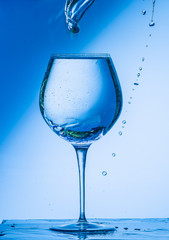 glass, wine, drink, water, alcohol, wineglass, blue, isolated, empty, white, liquid, transparent, clear, beverage, clean, object, crystal, goblet, reflection, drop, bar, single, fresh, cold, celebrati