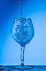 glass, wine, drink, water, alcohol, wineglass, blue, isolated, empty, white, liquid, transparent, clear, beverage, clean, object, crystal, goblet, reflection, drop, bar, single, fresh, cold, celebrati