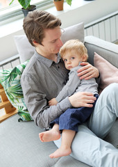 Young dad with his son at home, have a great time together, happy time, young family