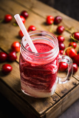 Healthy cherry smoothie with yogurt in jar. Selective focus. Shallow depth of field.