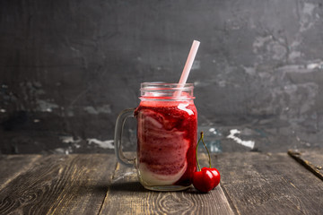 Healthy cherry smoothie with yogurt in jar. Selective focus. Shallow depth of field.