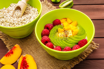 Oatmeal bowl with fresh berries and fruits