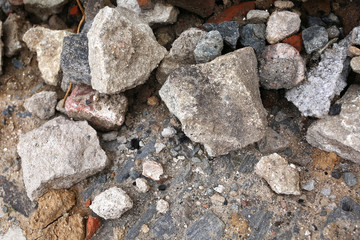 a lot of different stones for building a road on a city street