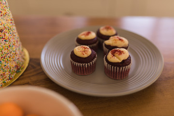 Cupcakes in a plate on a table at home