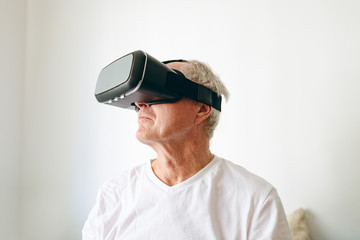 Senior male patient using virtual reality headset
