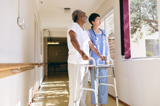 Female Nurse And Senior Male Patient Interacting