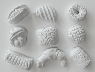 White painted pastry pieces on white background - 3D Rendering