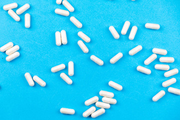 Tablets medicaments on a blue background